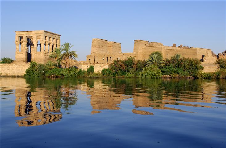 The Luxor Temple at sunset with golden light hitting ancient sandstone pillars